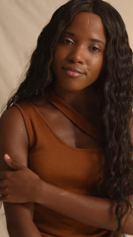 Studio-Portrait-Shot-Of-Young-Woman-Feeling-Softness-Of-Skin-After-Using-Beauty-Product-1